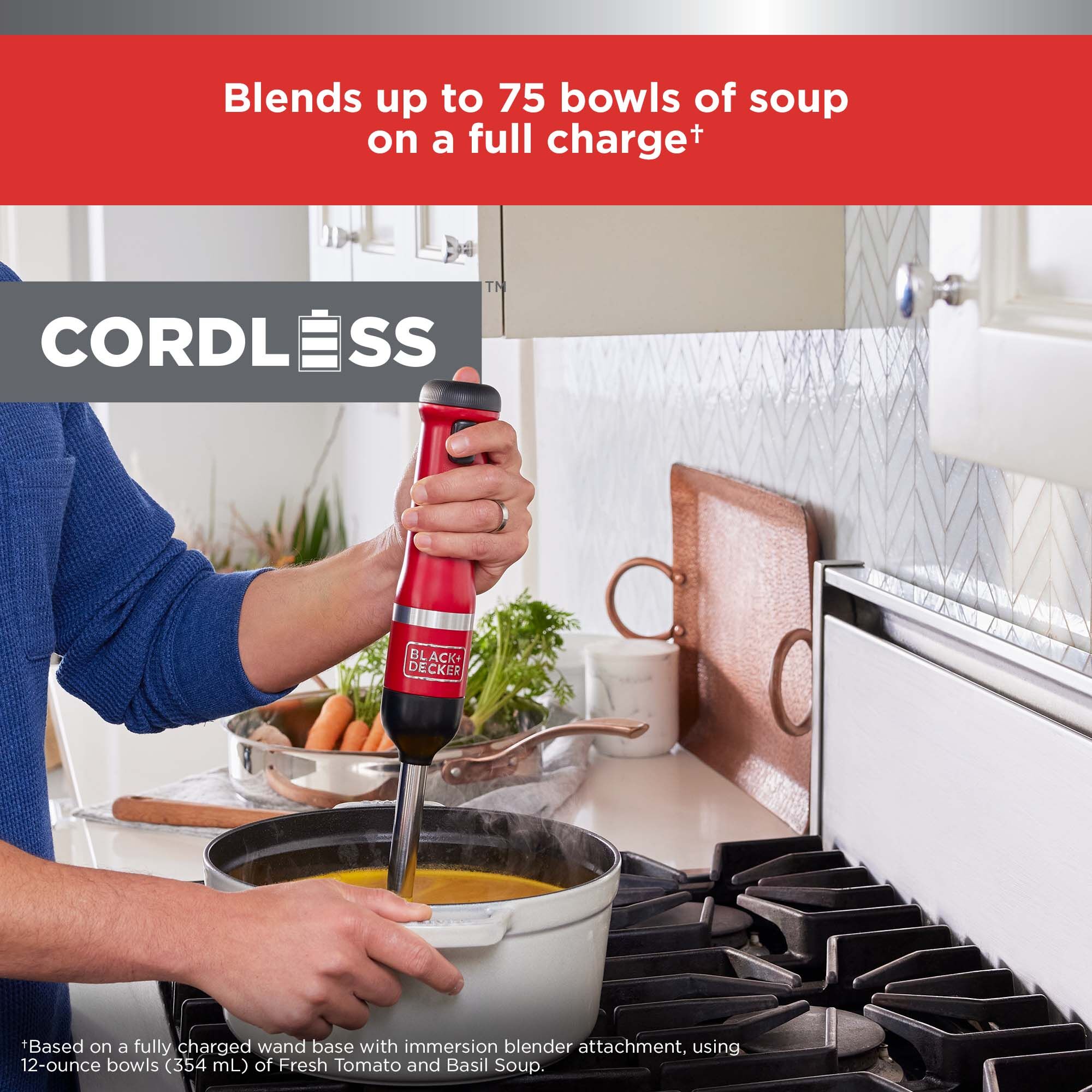 Red BLACK+DECKER kitchen wand immersion blender preparing a pot of soup