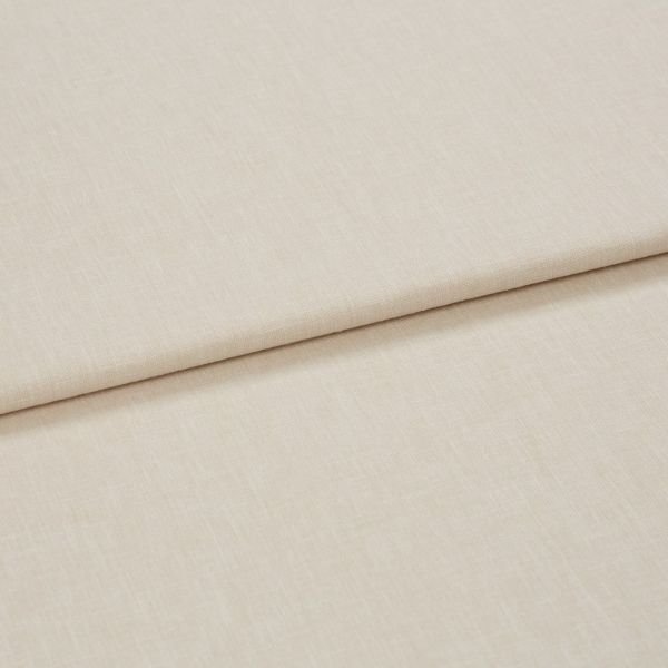 Beige woven curtain-like fabric panel with a clean horizontal fold (overlapping layer); lying flat on a neutral surface; close-up, soft diffuse lighting.