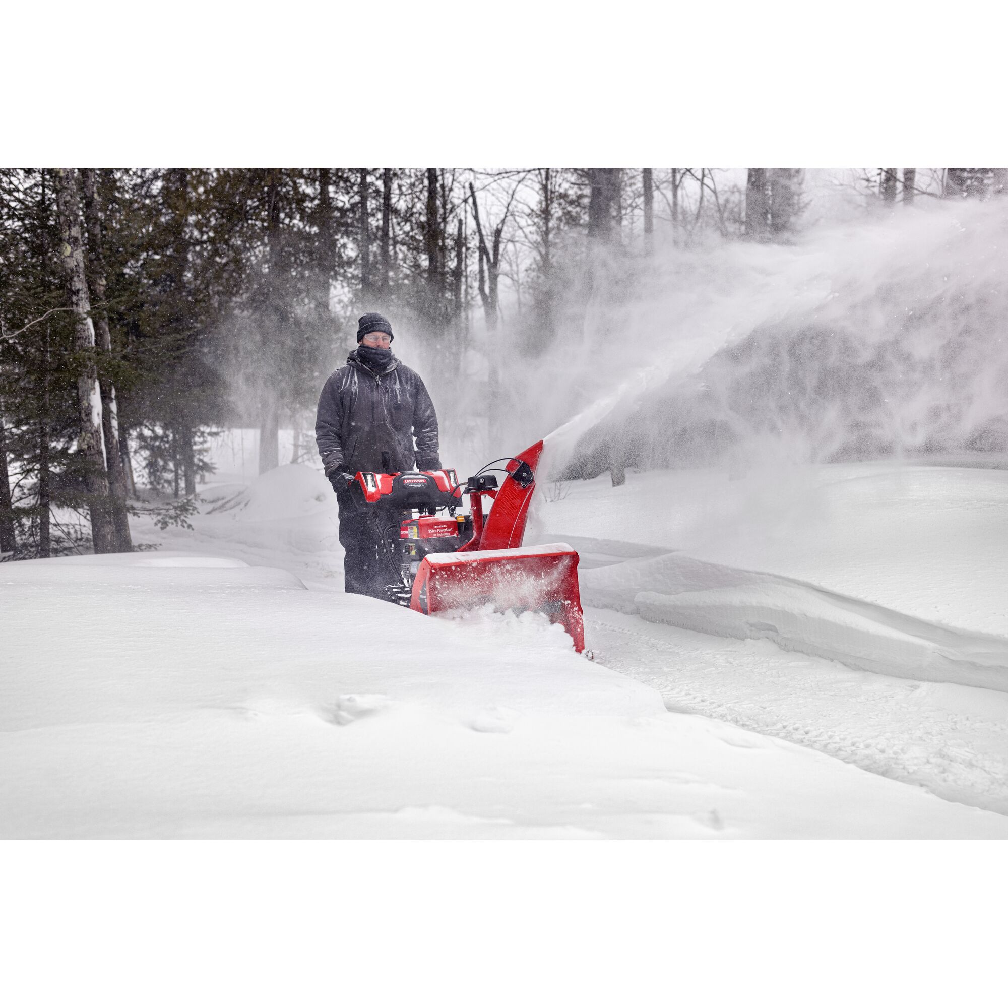 CRAFTSMAN Performance 28 Gas Snow Blower clearning driveway near wooded area