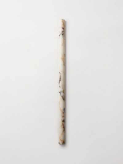 a marble candle holder on a white surface.