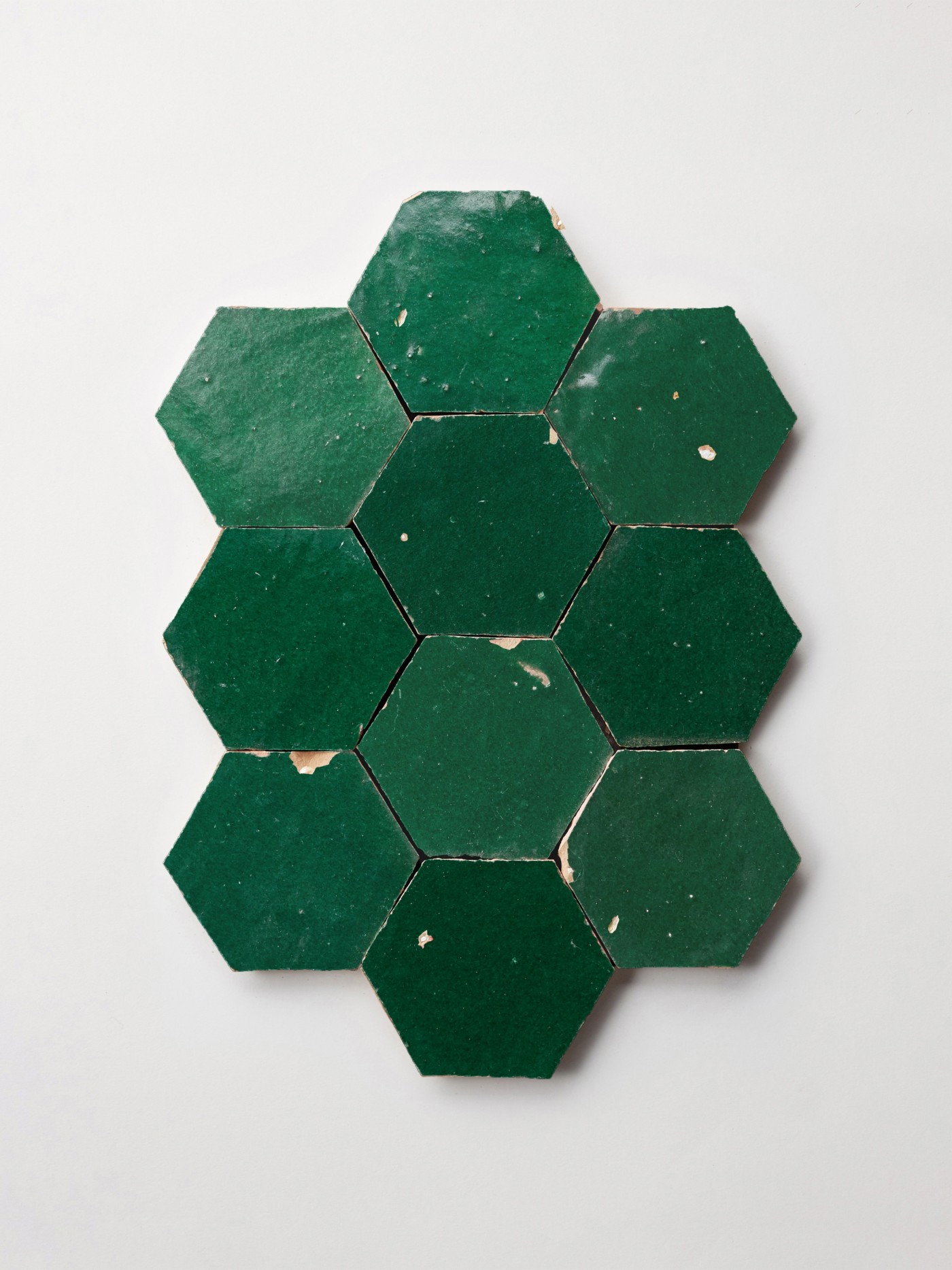 green hexagon tiles on a white background.