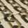 Cream fabric sample printed with repeating brown and black interlocking geometric shapes; folded across the center; close-up studio shot with soft, even lighting on a neutral background.