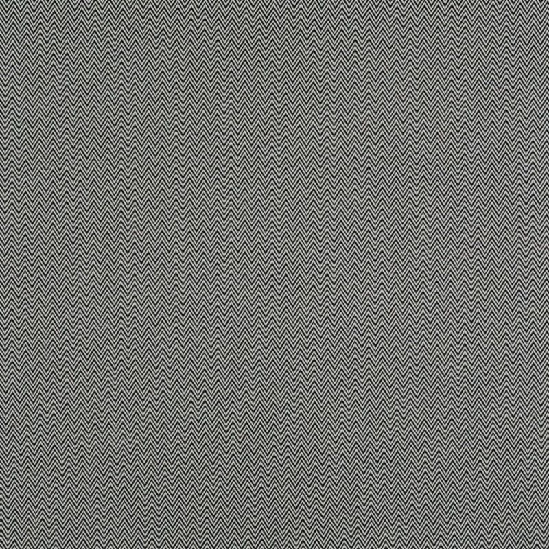 Chevron-patterned fabric curtains, two vertically seamed panels with small black-and-white zigzag weave, drawn closed, filling the frame and blocking view in diffuse indoor lighting.