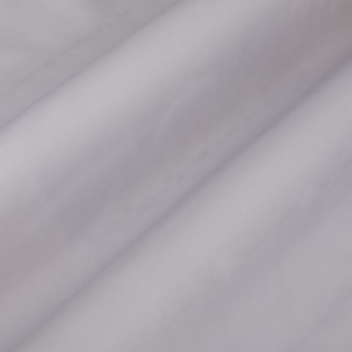 Pale lavender curtain fabric, hanging in soft diagonal folds, gently diffusing light in a neutral, dim interior close-up.