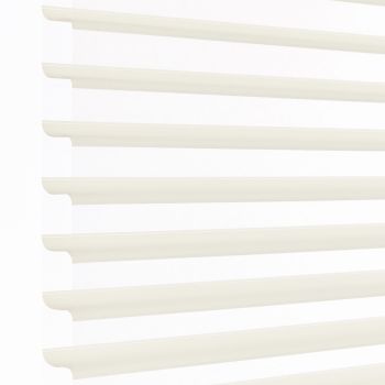 White layered zebra blinds with horizontal opaque slats and sheer panels, mounted left, covering window; slats angled to filter bright daylight into a minimally visible, softly lit interior.