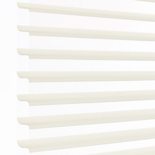 White layered zebra blinds with horizontal opaque slats and sheer panels, mounted left, covering window; slats angled to filter bright daylight into a minimally visible, softly lit interior.