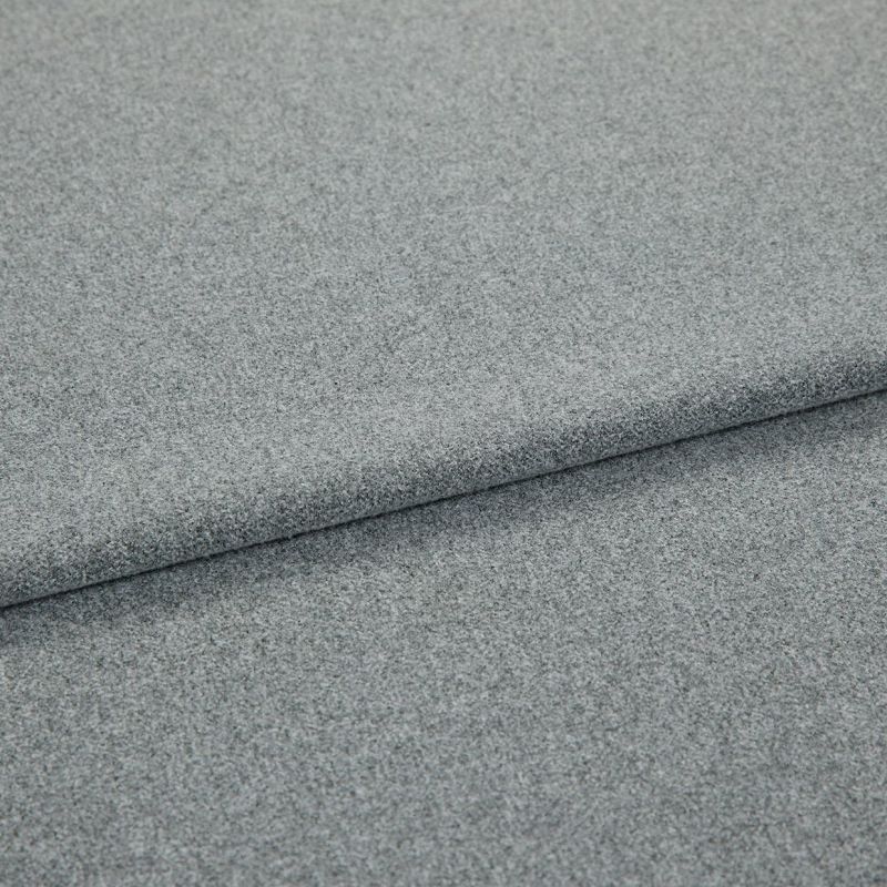 Grey, fine-textured upholstery fabric folded in overlapping layers; tightly woven, slightly napped surface. Close-up view on a flat, neutral background with soft, even lighting emphasizing texture.