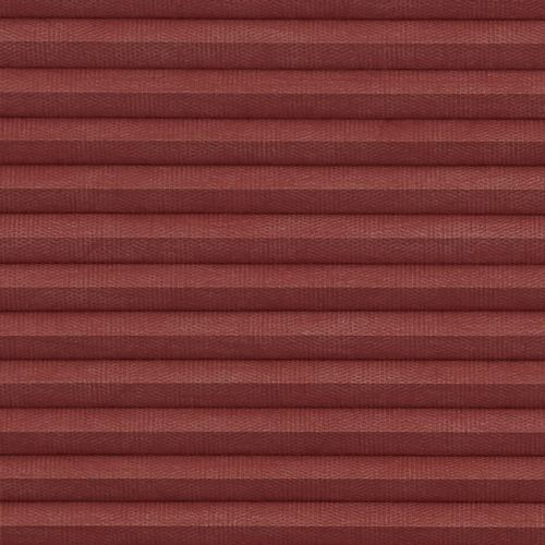 Burgundy fabric pleated blind with evenly spaced horizontal folds, fully lowered and closed, blocking light; close-up view shows woven texture and soft, diffuse indoor lighting.