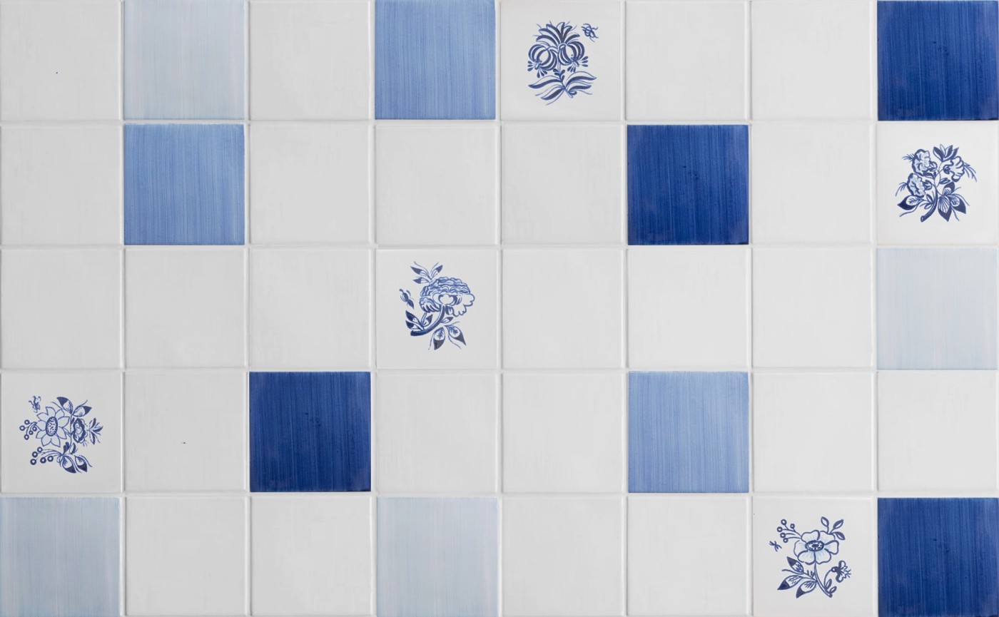 blue and white tiles with flowers on it.