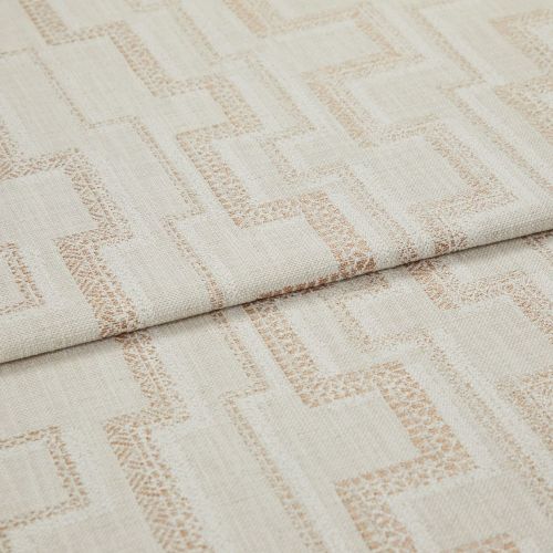 Beige woven fabric with light-brown geometric square pattern (curtain/upholstery fabric) folded over itself, revealing textured weave; close-up studio product view under soft, neutral lighting.