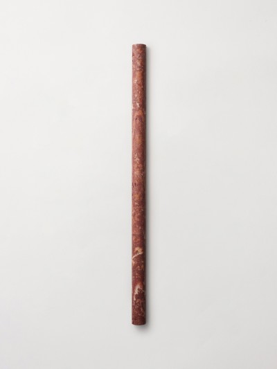 a red marble pencil on a white background.
