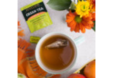 Lifestyle image of cup of Bigelow Green Tea with Peach