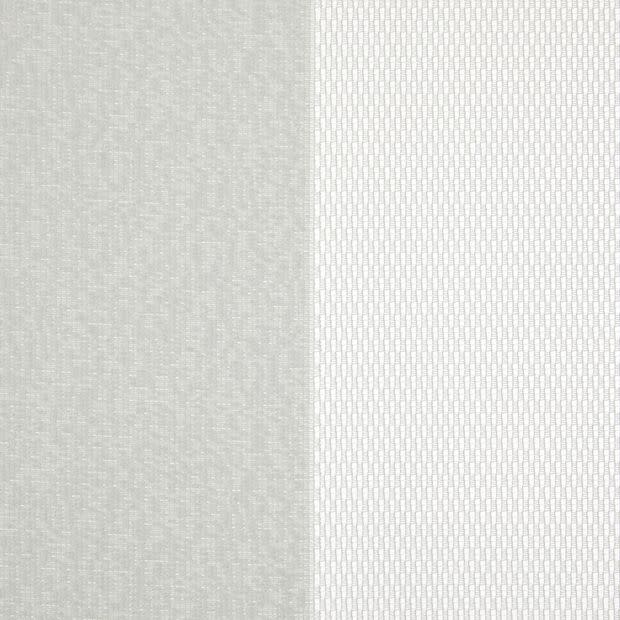 Two vertical fabric panels (curtains): left opaque light gray textured, right sheer white with small rectangular pattern; both closed, gently filtering diffuse daylight in a neutral-lit interior.