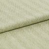 Pale green woven fabric with raised diagonal ribbed herringbone pattern, folded across the frame; the fabric displays pronounced texture and ridges under soft, even studio lighting in a close-up view.