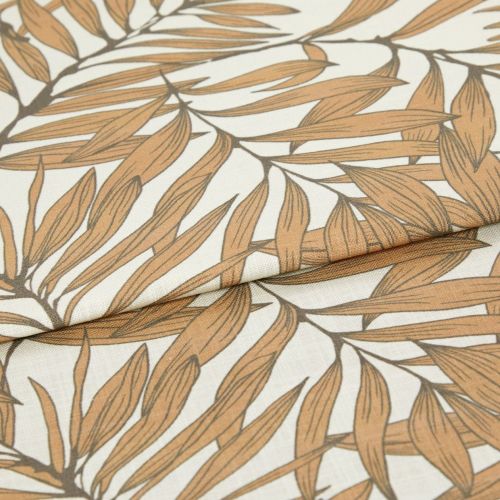 Patterned fabric: folded linen-like textile with overlapping fold. It displays a repeating botanical leaf design in warm tan outlines on a cream background, photographed close-up with soft, even lighting.