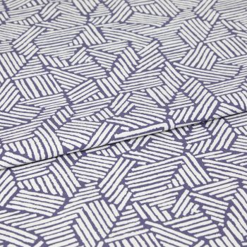 Folded fabric with purple background and white hand-drawn diagonal stripe hexagon pattern; the cloth is folded once with a visible overlap; close-up on a flat surface under even studio lighting.