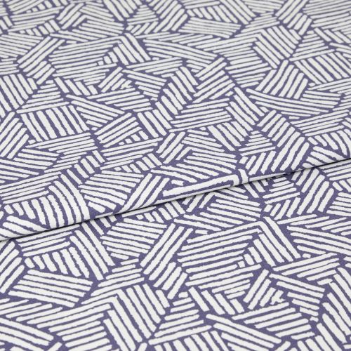 Folded fabric with purple background and white hand-drawn diagonal stripe hexagon pattern; the cloth is folded once with a visible overlap; close-up on a flat surface under even studio lighting.