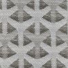 Woven curtain or fabric panel with repeating triangular/chevron motifs, displayed flat to reveal a high-contrast dark-and-light weave; close-up view, evenly lit, no surrounding room visible.