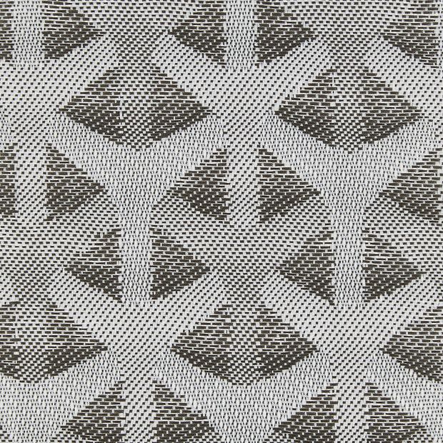 Woven curtain or fabric panel with repeating triangular/chevron motifs, displayed flat to reveal a high-contrast dark-and-light weave; close-up view, evenly lit, no surrounding room visible.