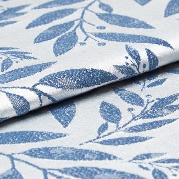 Folded woven fabric with raised blue leaf jacquard pattern; folded and overlapping, revealing textured weave and subtle sheen; close-up product-style shot with soft, neutral lighting suggesting upholstery or curtain material.