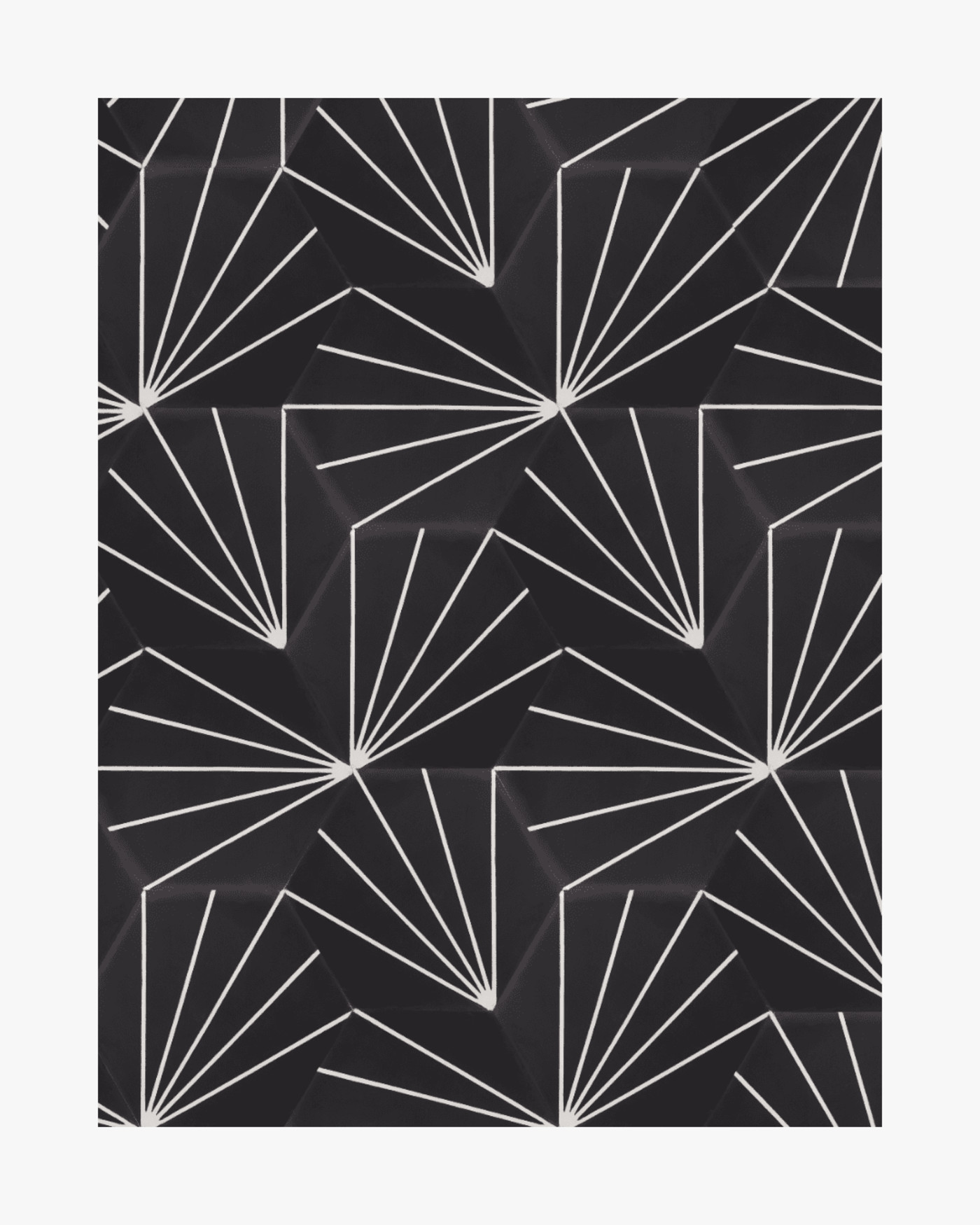 a black and white geometric pattern on a wall.