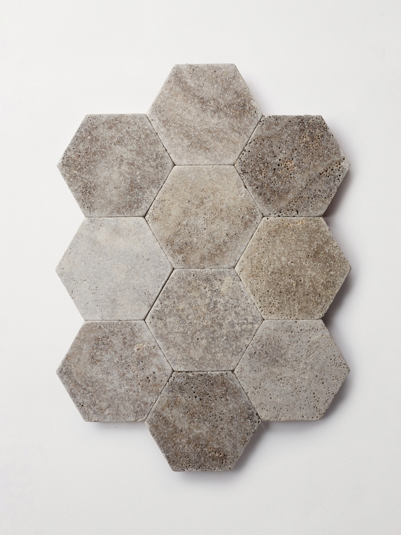 grey hexagonal tiles in a pattern on a white surface.