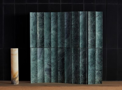 a green marble wall panel with a wooden base.