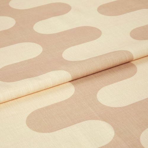 Curtain fabric sample, linen-like with oversized rounded beige-and-cream geometric pattern, folded across the center; studio close-up with soft even lighting and visible woven texture.