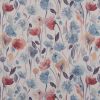 Floral watercolor fabric (curtain or wallpaper) with repeating blue, coral, and purple blossoms and leaves â€” covering a flat surface; soft, even lighting, close-up, pale neutral background.