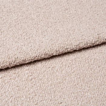 Beige bouclÃ© fabric with dense looped texture, folded over itself forming a soft ridge; close-up studio view of an upholstery/carpet sample under diffuse neutral lighting.