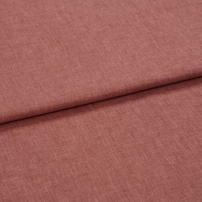 Dusty-rose woven fabric (linen-like), folded once forming a horizontal overlap; textured weave visible, shown in soft diffuse lighting as a close-up flat lay on a neutral surface.