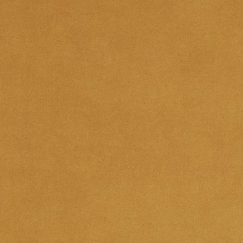 Tan, slightly mottled paper filling the frame; flat and unwrinkled, evenly lit, resembling kraft cardboard with subtle fiber texture, occupying a plain neutral background.