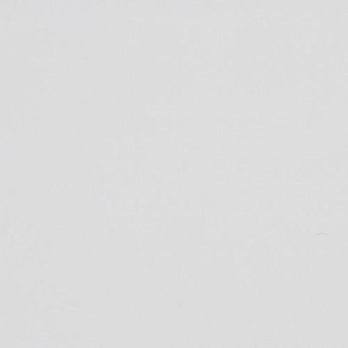 Blank off-white surface shows faint scuffs and tiny specks, evenly lit in a close-up, minimal context with subtle paper- or plaster-like texture.