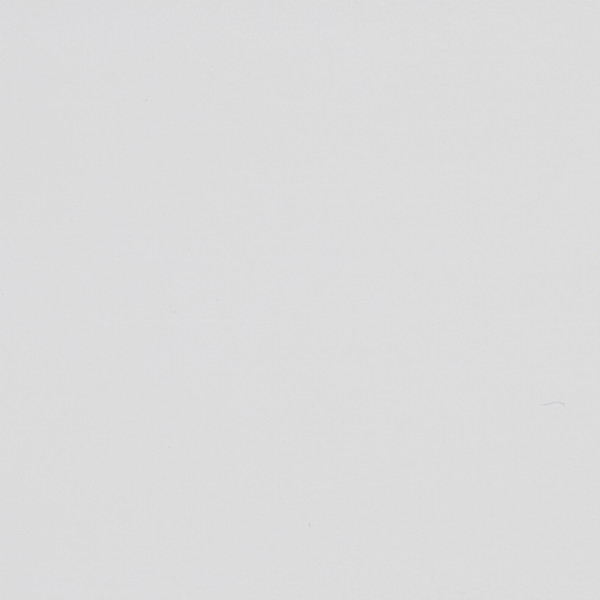 Blank off-white surface shows faint scuffs and tiny specks, evenly lit in a close-up, minimal context with subtle paper- or plaster-like texture.