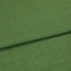Green woven fabric panel, folded across the frame creating a horizontal ridge; fine textured weave visible, close-up with soft even lighting and neutral background.
