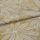 Botanical-patterned upholstery fabric, folded to show a layered edge; cream leaf-and-flower woven motif on mustard-yellow background, close-up studio shot with soft even lighting.