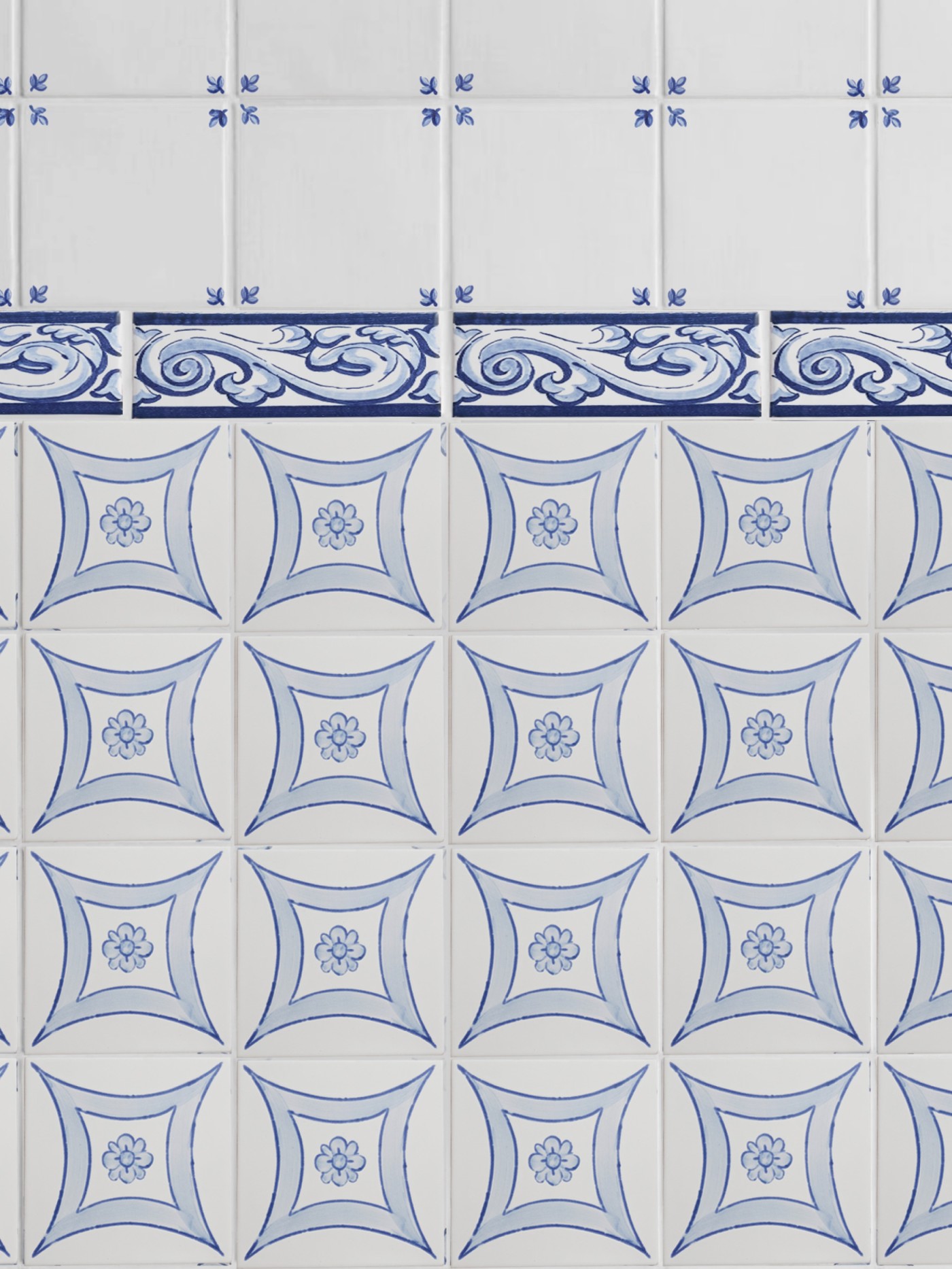 a blue and white tiled bathroom wall.