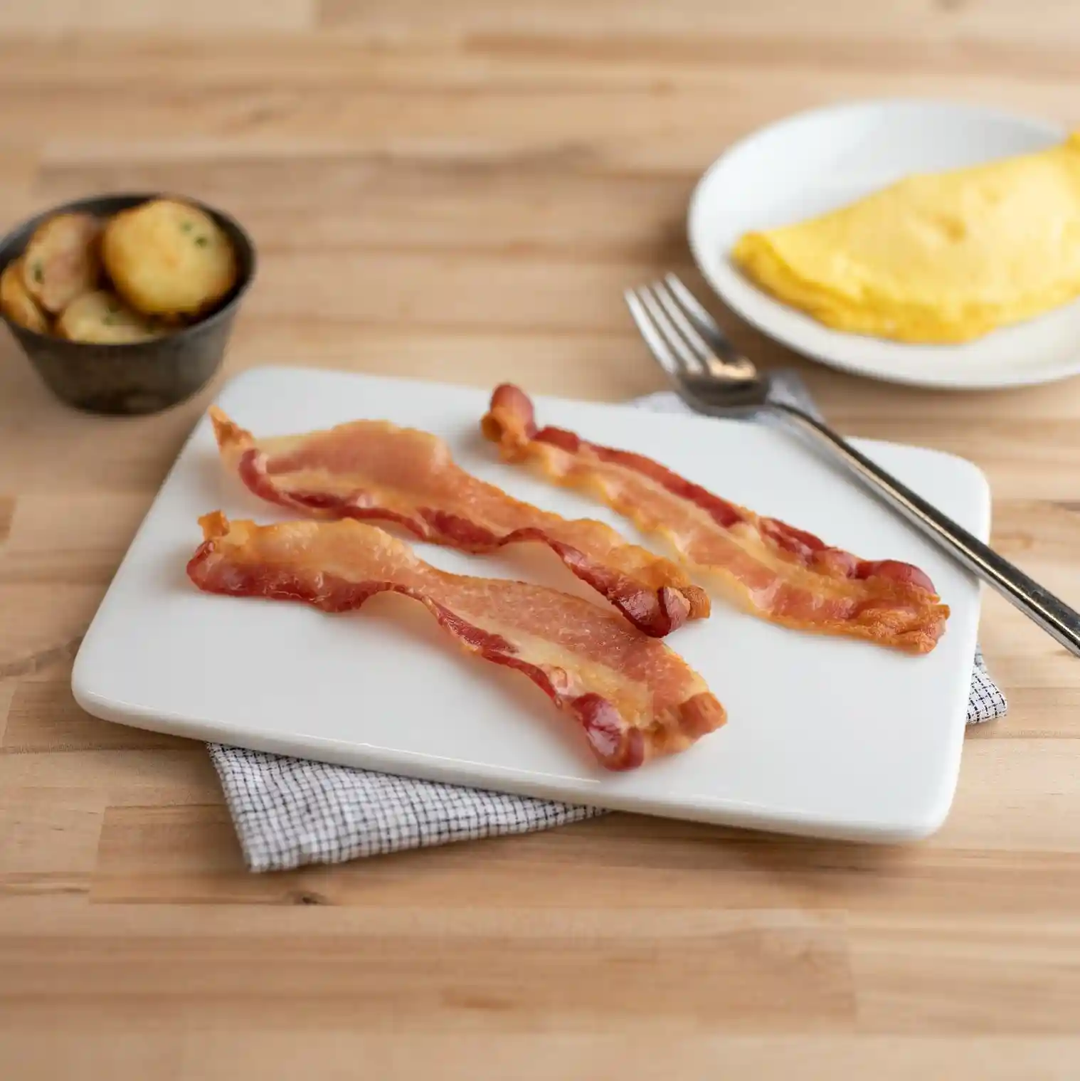 Wright® Brand Applewood Smoked Thin Sliced Flat-Pack® Bacon https://images.salsify.com/image/upload/s--T9wHmLpb--/q_25/2c00ef8524d522b98a1a606410ed02bfa1ac1c21.webp