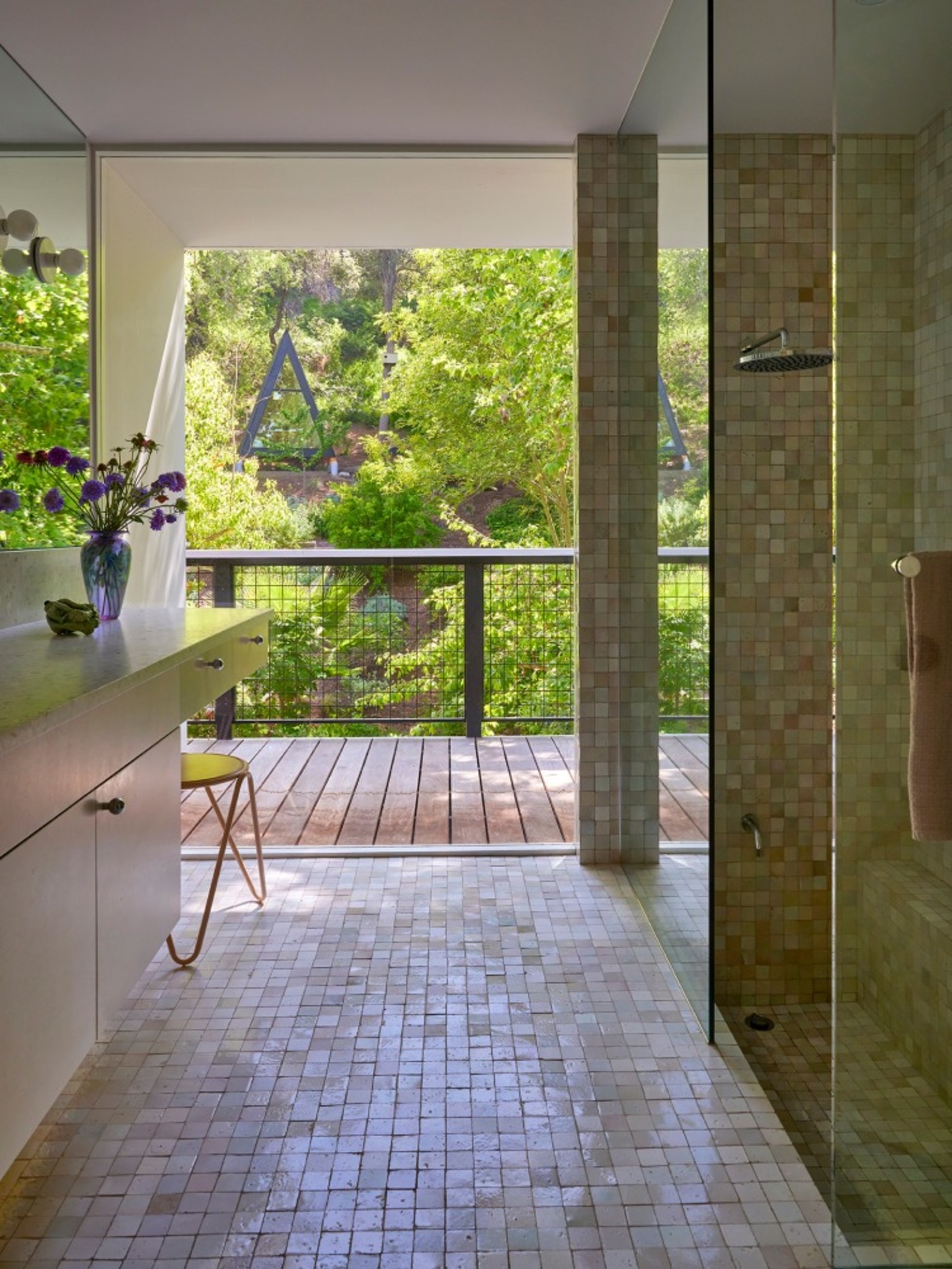 a modern bathroom with a glass shower stall.