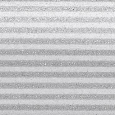 Horizontal pleated blinds, closed, showing alternating light and dark textured bands; filtering soft diffuse light; close-up view filling the frame, neutral grayscale tones suggesting indoor lighting.