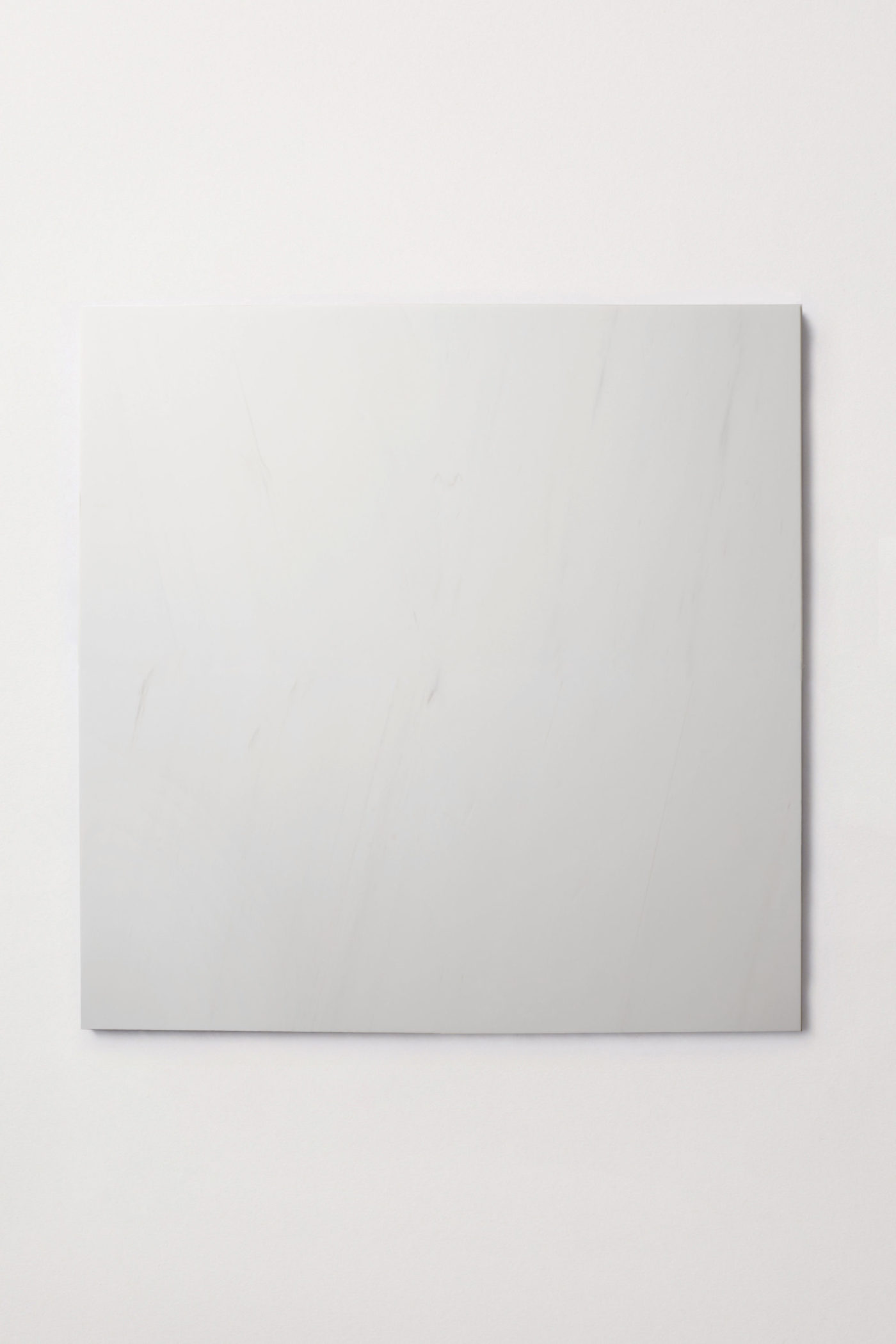 a square white tile on a white background.