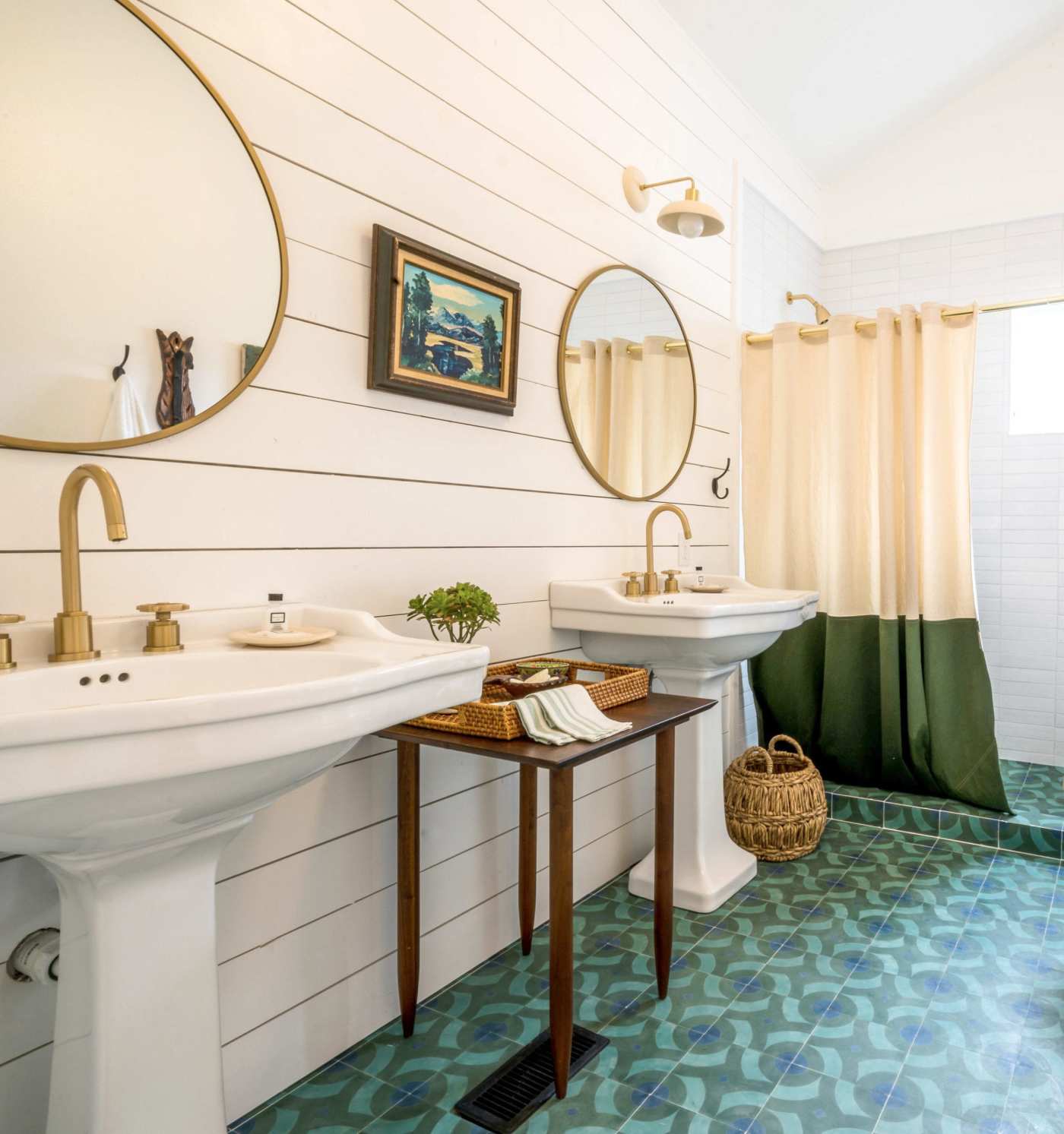 a bathroom with a blue and green tiled floor.