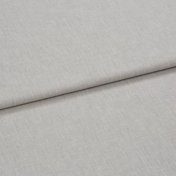 Light gray linen-like fabric folded horizontally, creating a soft crease; close-up shows fine woven texture under even neutral lighting, appearing as a fabric sample or upholstery material on a flat surface.