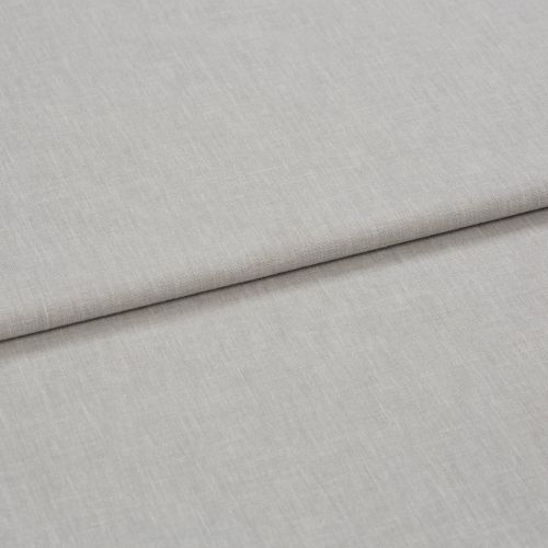 Light gray linen-like fabric folded horizontally, creating a soft crease; close-up shows fine woven texture under even neutral lighting, appearing as a fabric sample or upholstery material on a flat surface.
