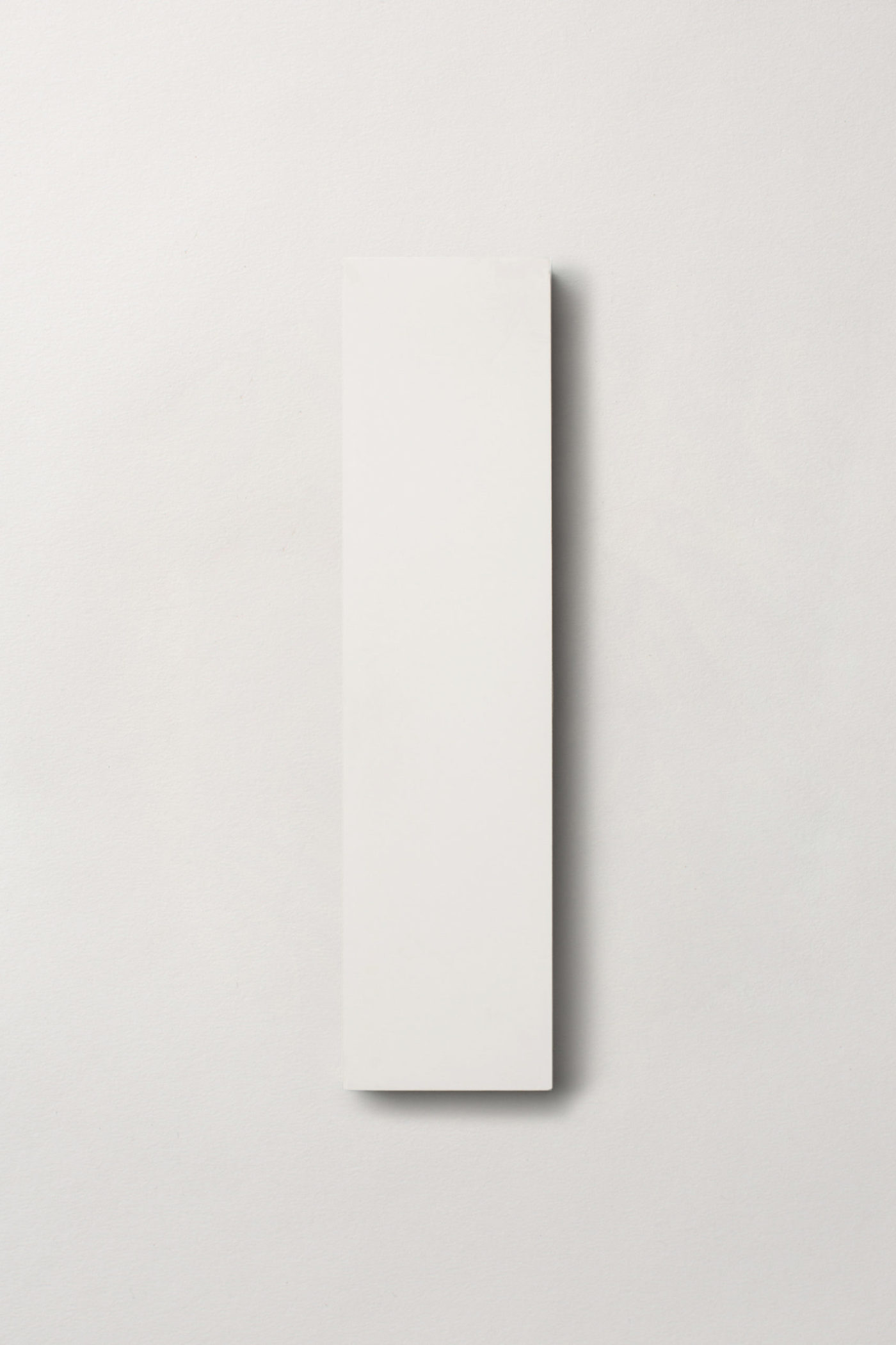 a white rectangle tile on a white background.