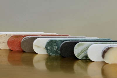 a row of marble soap dispensers on a table.