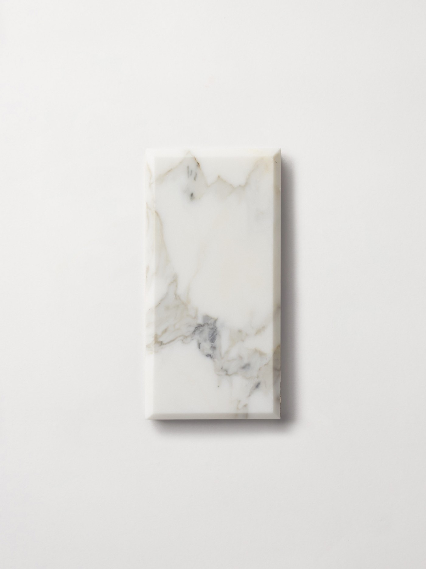 a white marble slab on a white surface.