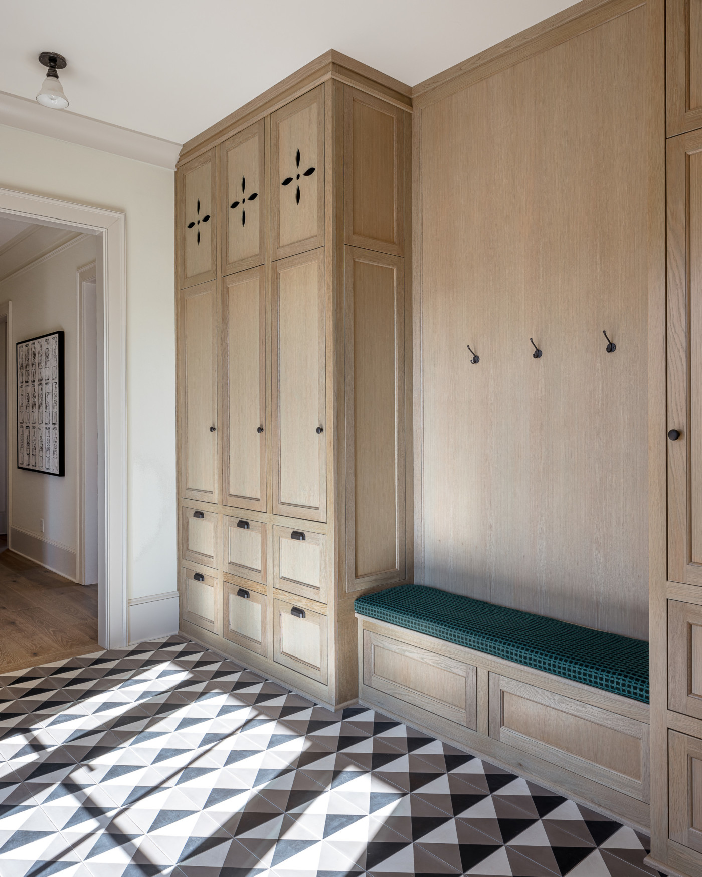 a hallway with a black and white checkered floor.