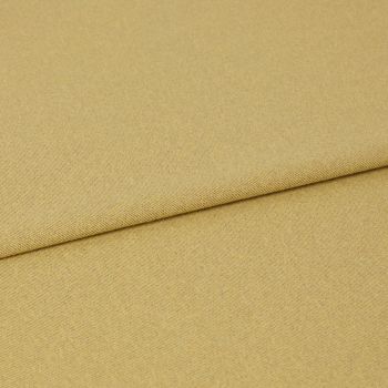Mustard-yellow woven fabric folded with an overlapping edge near the upper third, showing subtle diagonal twill texture; close-up on a flat surface under even, neutral studio lighting.
