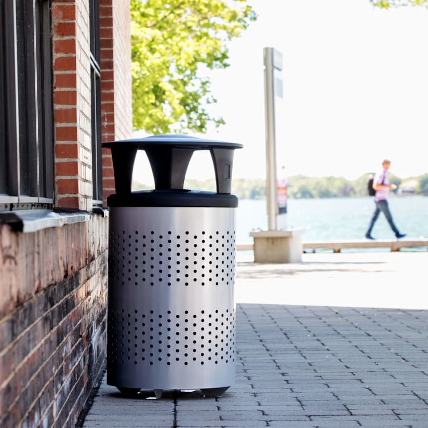 silver and black outdoor durable trash bin with a canopy lid to keep rain and snow from contaminating contents